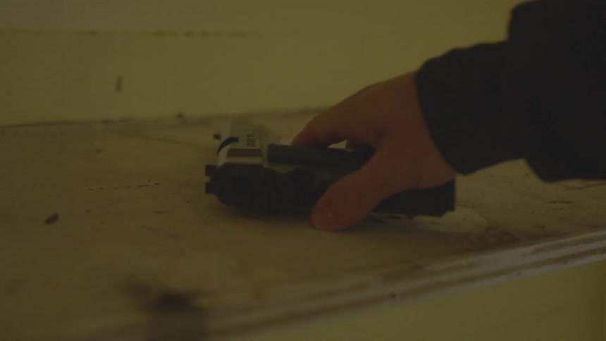 Man With Gun In Abandoned House