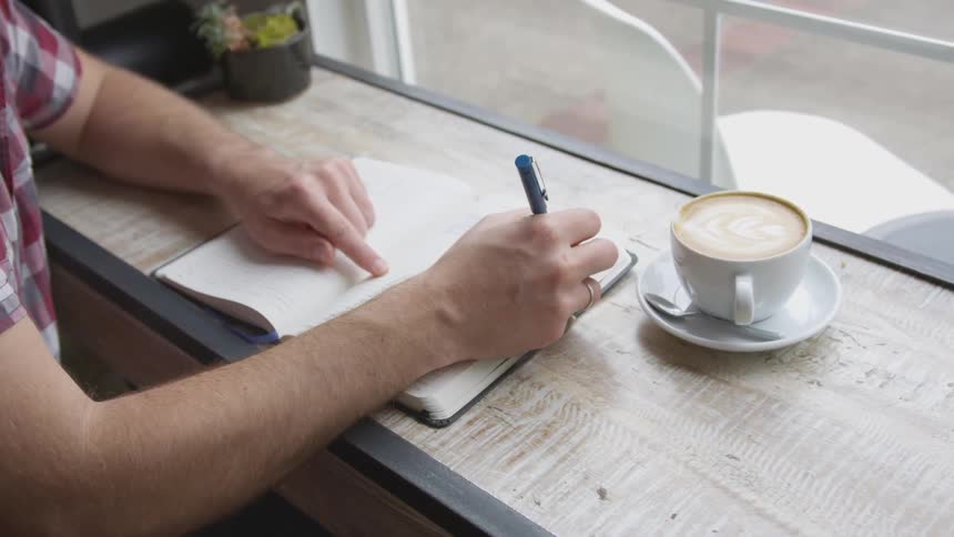 Man Working At Coffee Shop