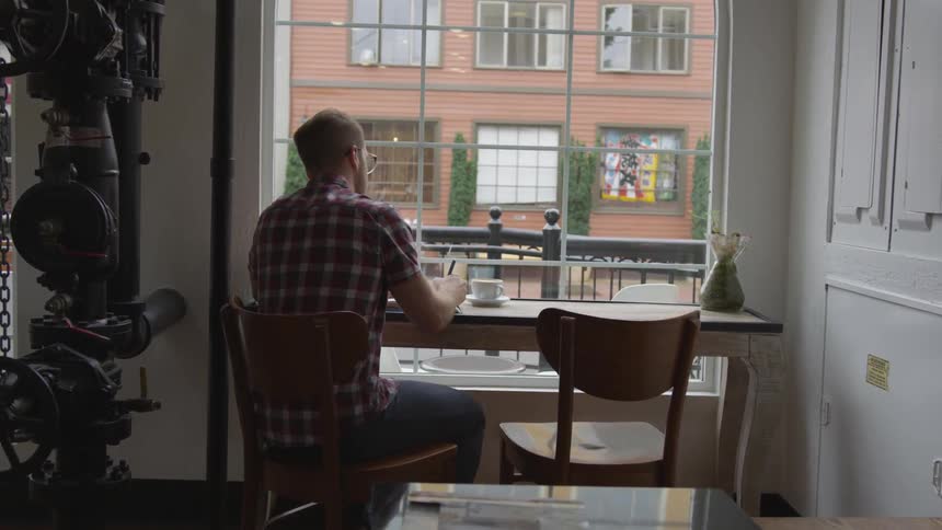 Man Working At Coffee Shop