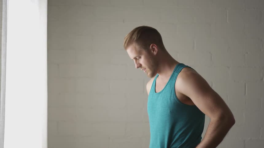 Man Working Out In Empty Room