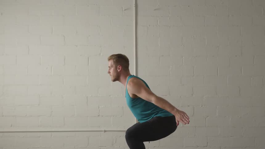 Man Working Out In Empty Room