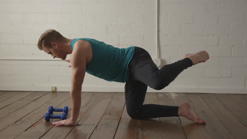 Man Working Out In Empty Room