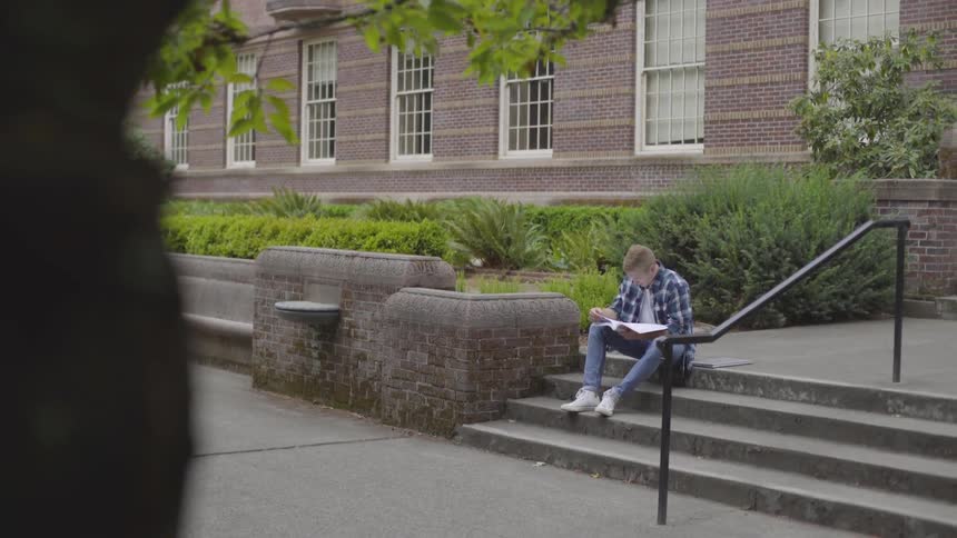 Man Studying On Campus