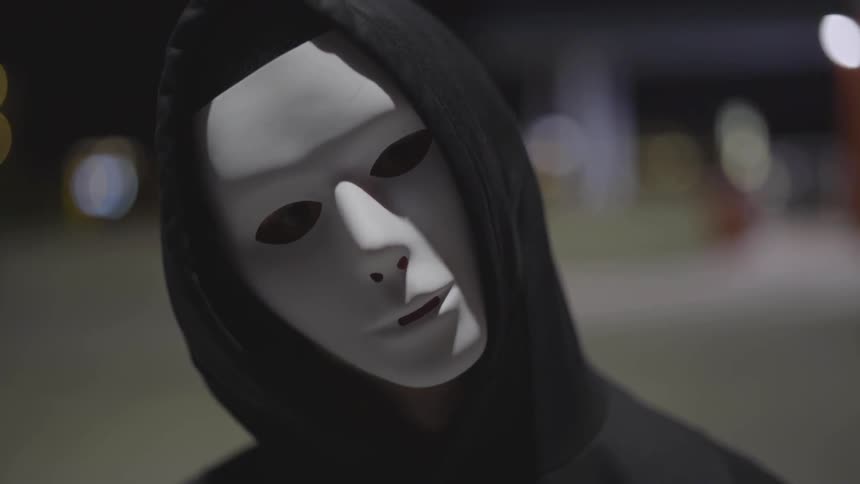 Man Wearing Mask With A Gun At Night