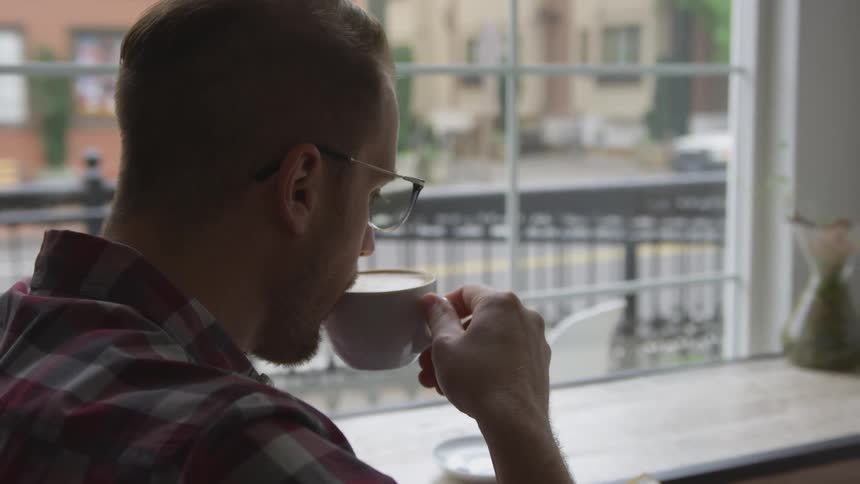 Man Working At Coffee Shop