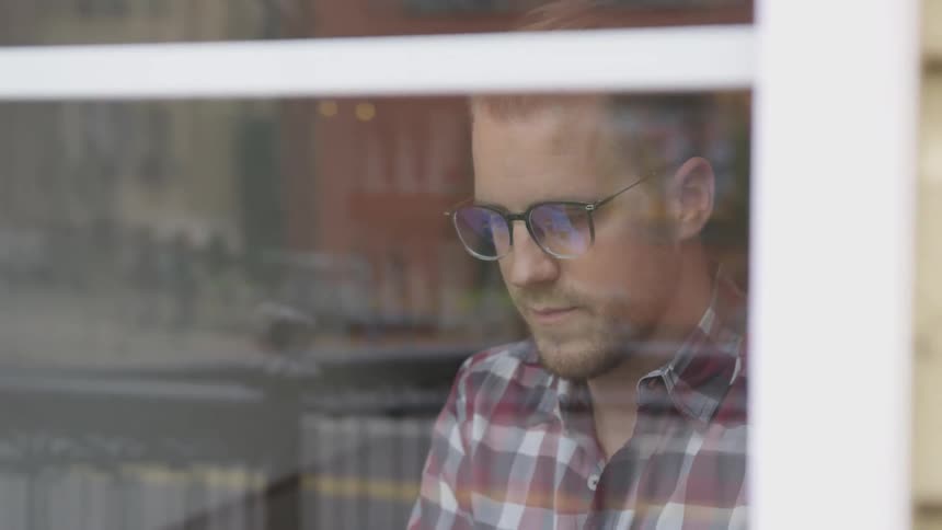 Man Working At Coffee Shop