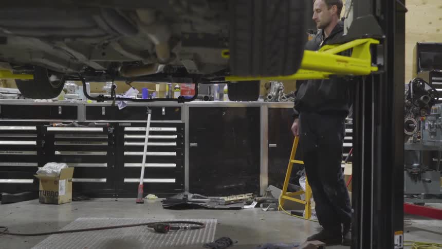 Mechanic Working On Car