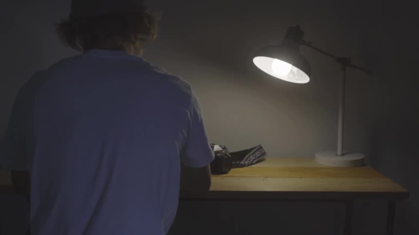 Man Using Laptop At Desk