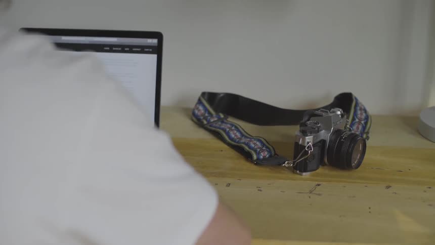 Man Using Laptop At Desk