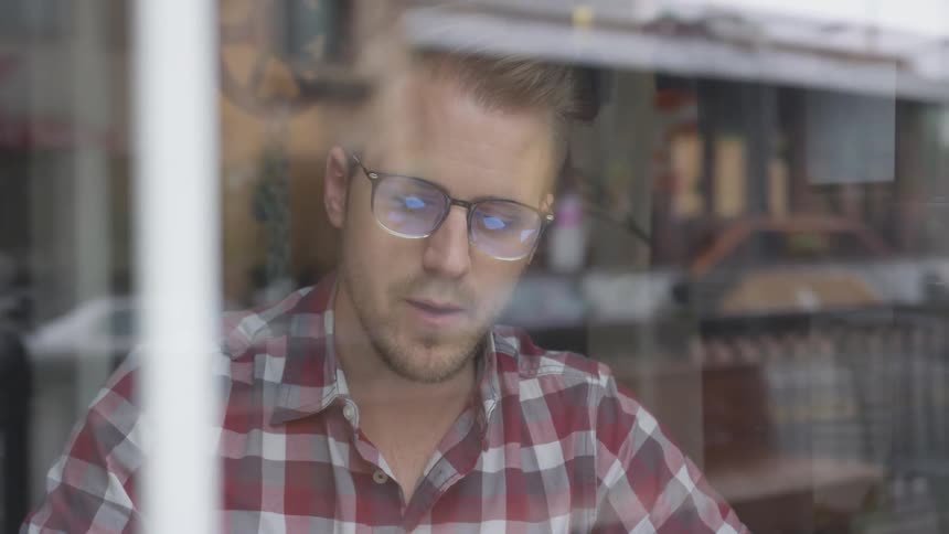 Man Working At Coffee Shop