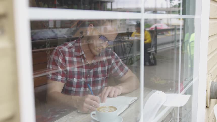 Man Working At Coffee Shop