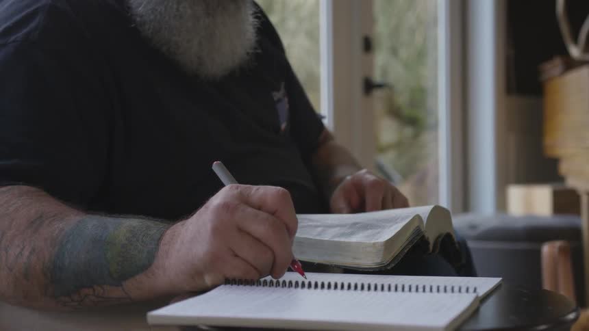 Man With Bible And Dogs