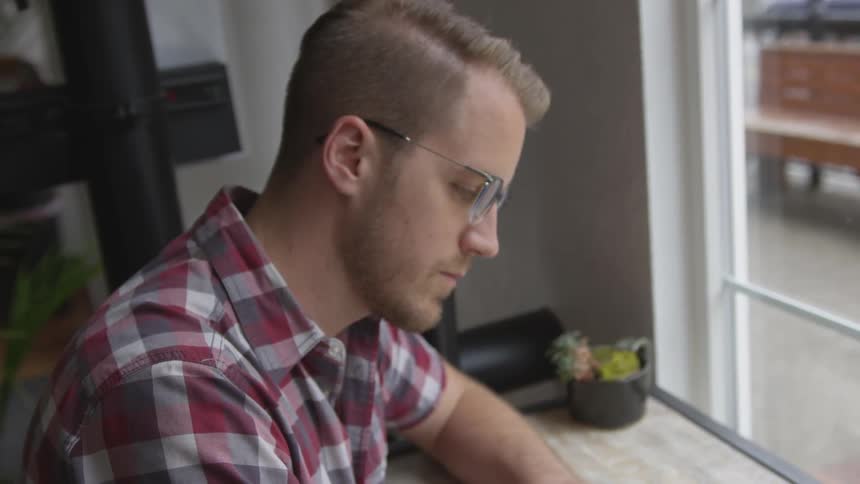 Man Working At Coffee Shop