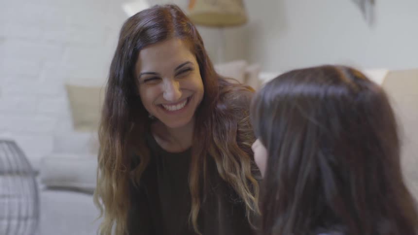 Mother Helping Daughter With Homework