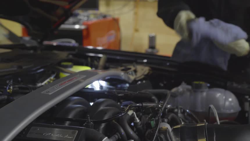 Mechanic Working On Car