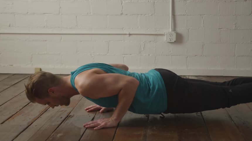 Man Working Out In Empty Room