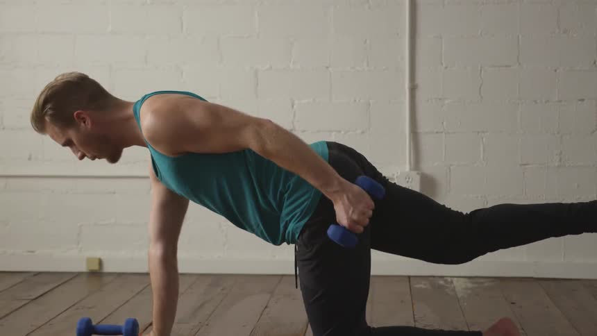 Man Working Out In Empty Room