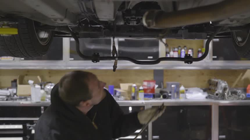 Mechanic Working On Car