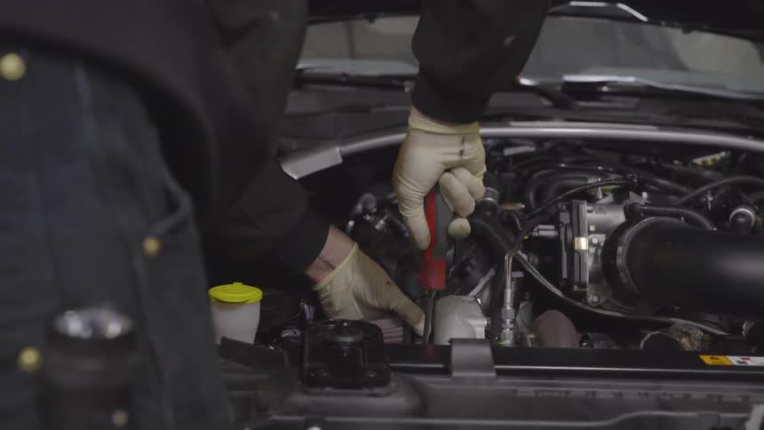Mechanic Working On Car