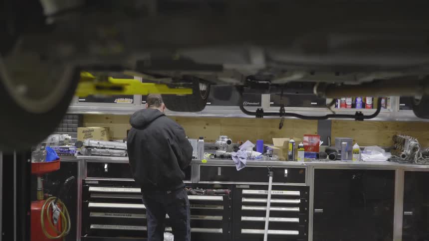 Mechanic Working On Car