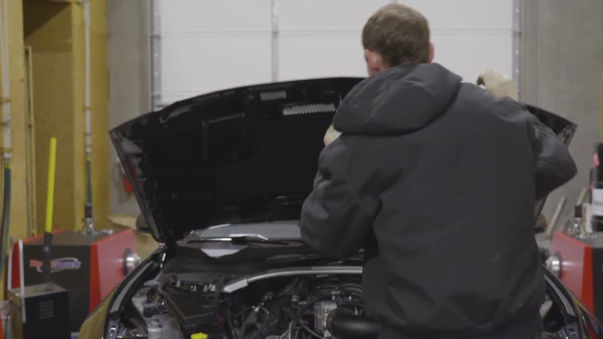 Mechanic Working On Car