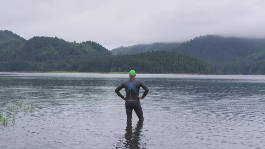 Man Swimming In Lake