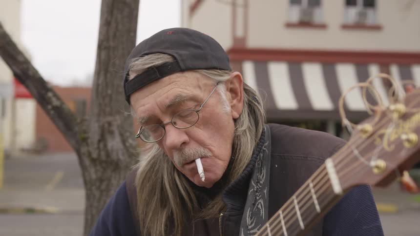 Musician Playing And Smoking