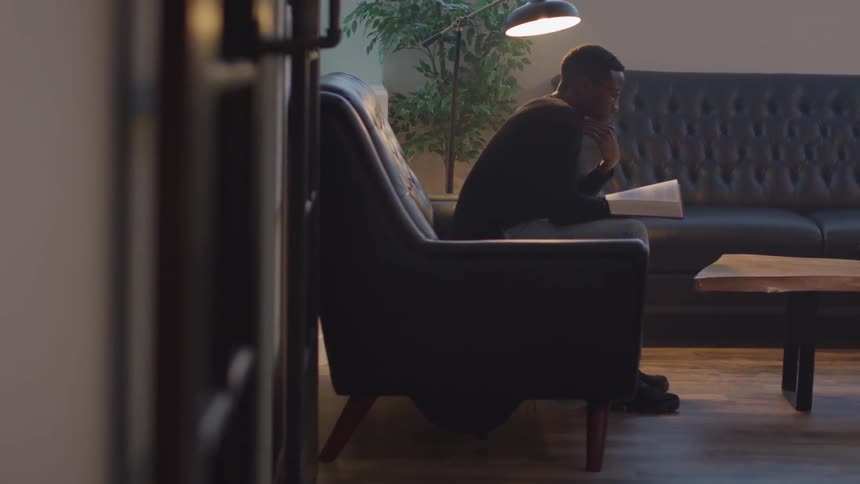 Man Walking And Reading Bible