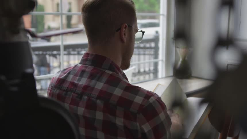 Man Working At Coffee Shop