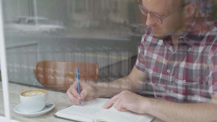 Man Working At Coffee Shop