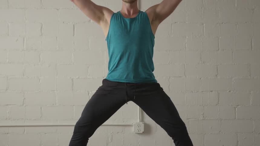 Man Working Out In Empty Room