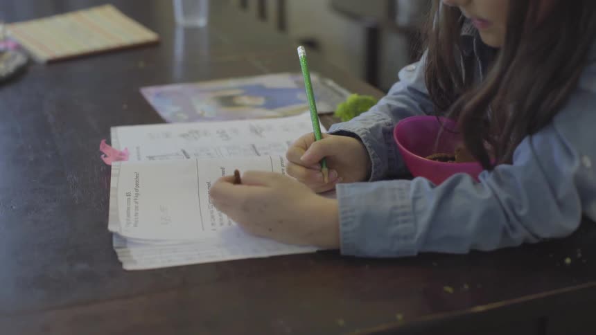 Mother Helping Daughter With Homework