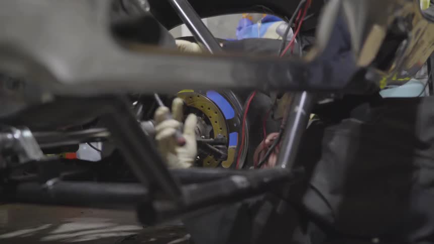 Mechanic Working On Car