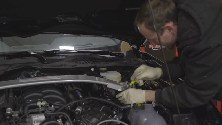 Mechanic Working On Car