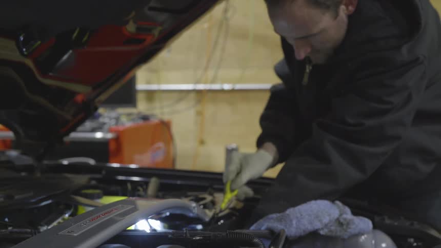 Mechanic Working On Car