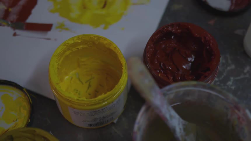 Older Man Painting In Studio