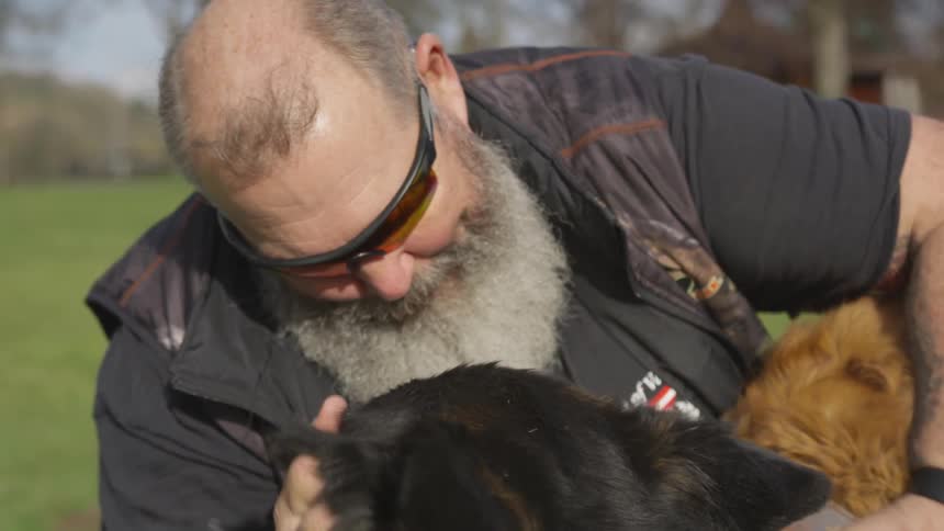 Man With Bible And Dogs