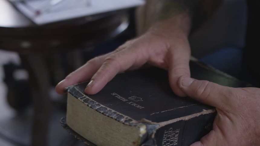 Man With Bible And Dogs