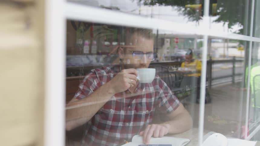 Man Working At Coffee Shop