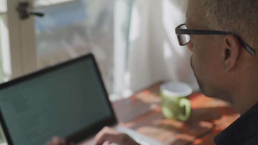 Man Working At Desk
