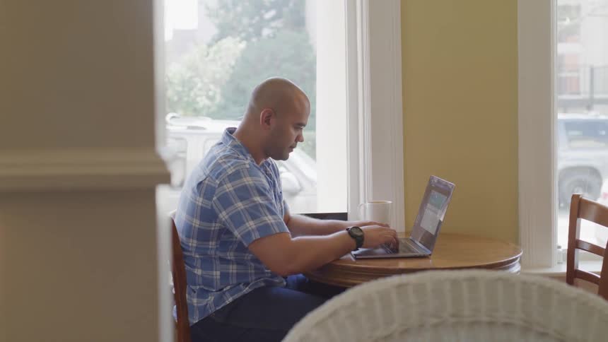 Man Working On Computer At Home