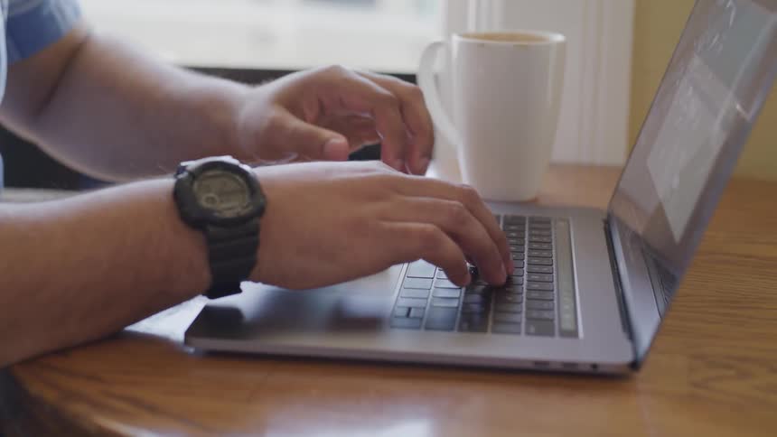 Man Working On Computer At Home