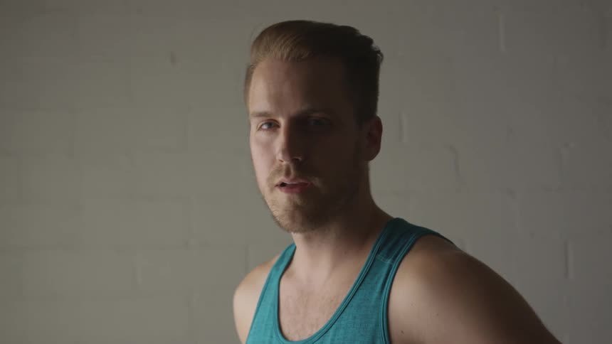 Man Working Out In Empty Room