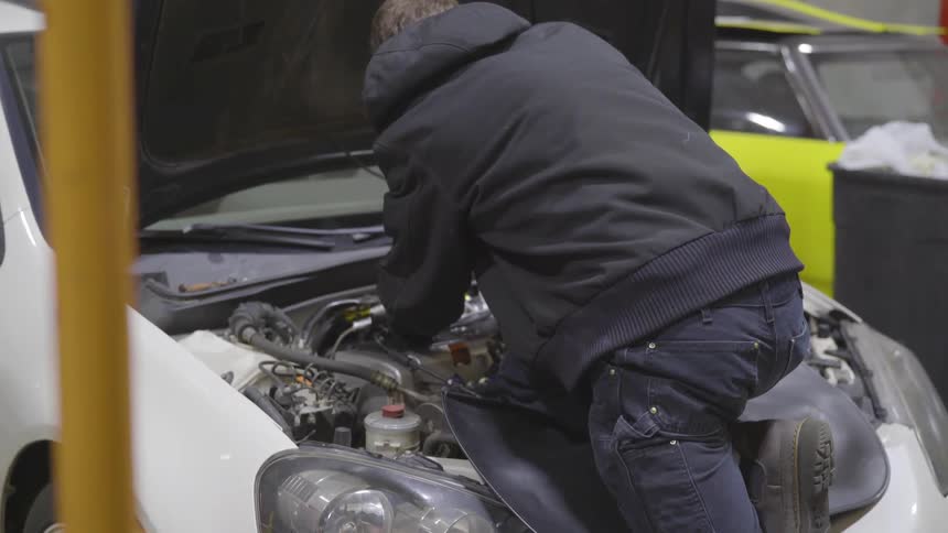 Mechanic Working On Car