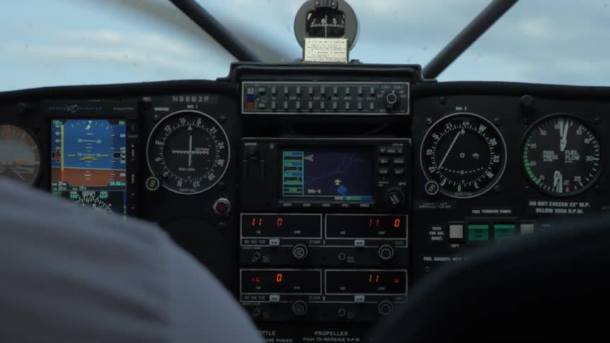 Pilot Flying Plane Through Snowy Mountains