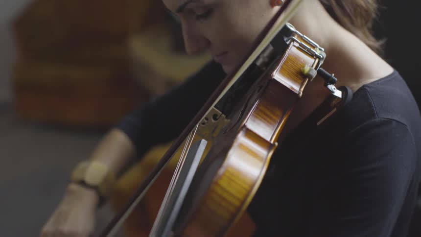 People Playing Violin