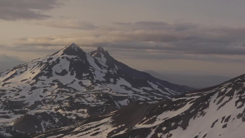 Pilot Flying Plane Through Snowy Mountains