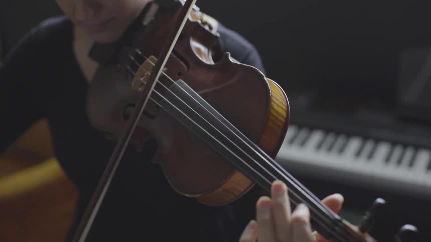 People Playing Violin