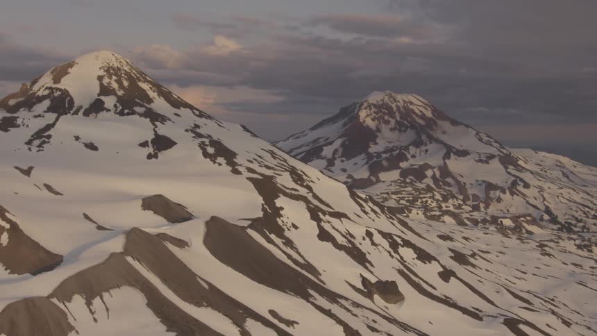 Pilot Flying Plane Through Snowy Mountains