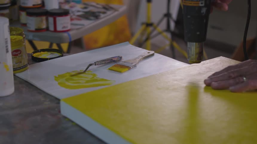 Older Man Painting In Studio